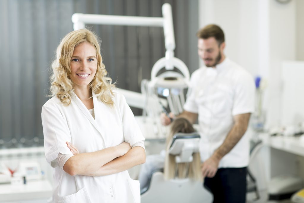 A good dentist right before patient's chair