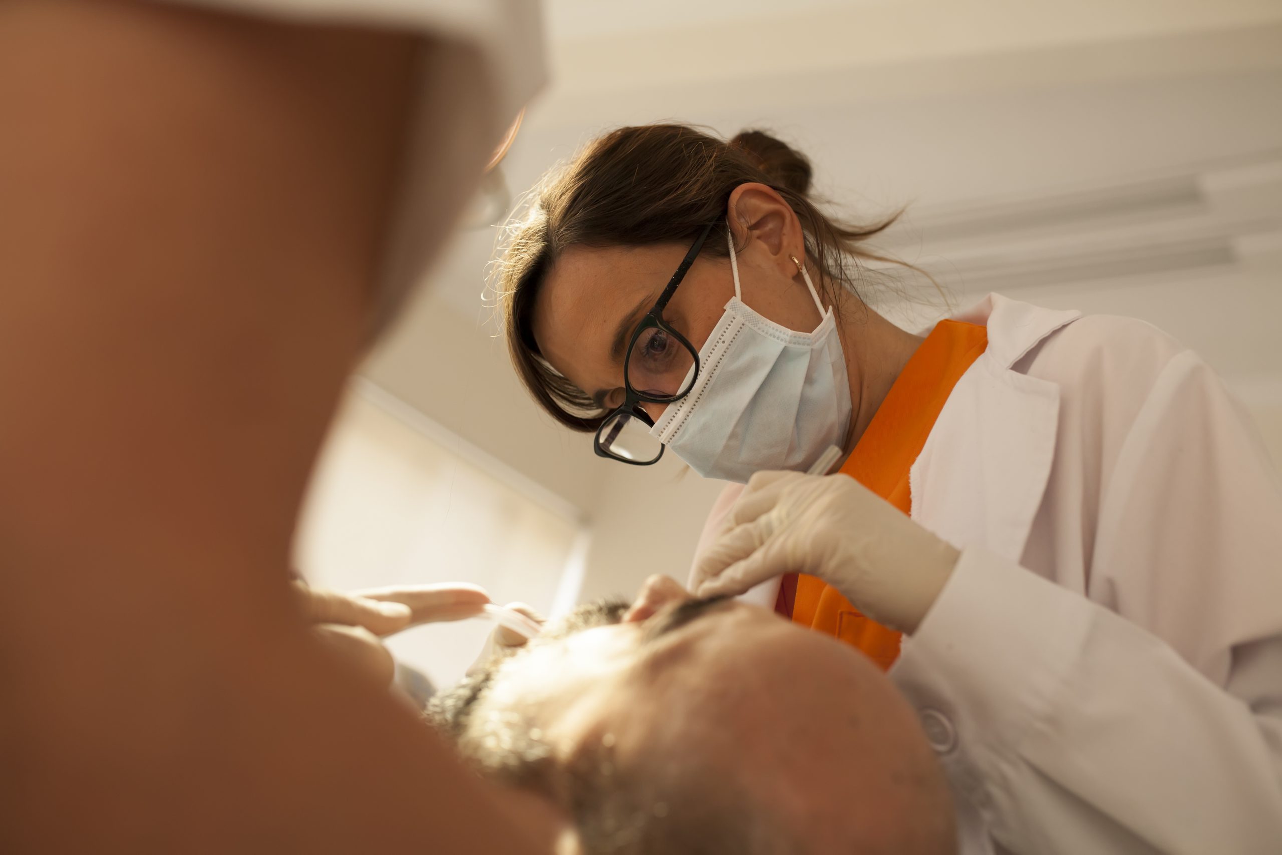 Dentist taking care of patient