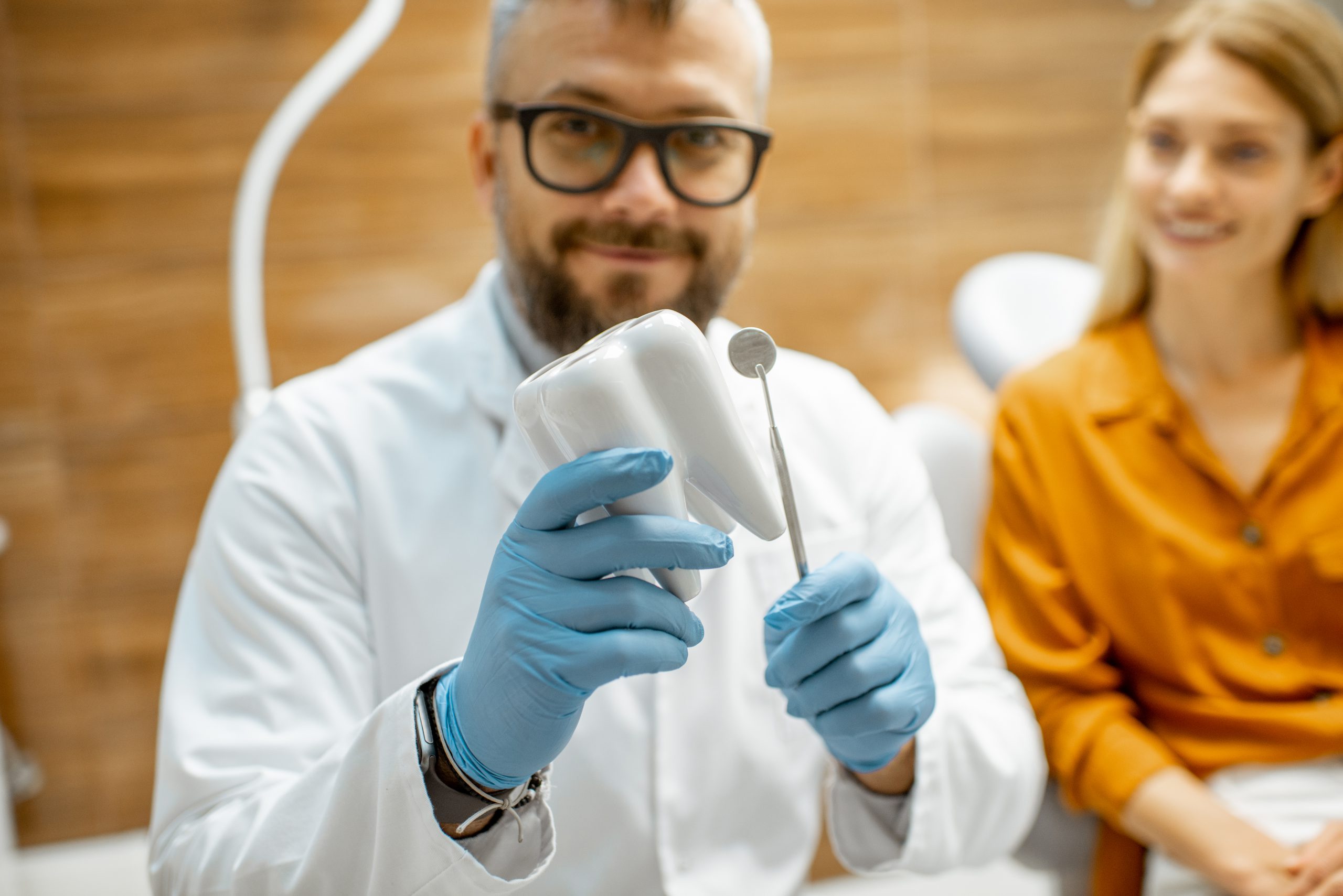 Dentist and smiling patient