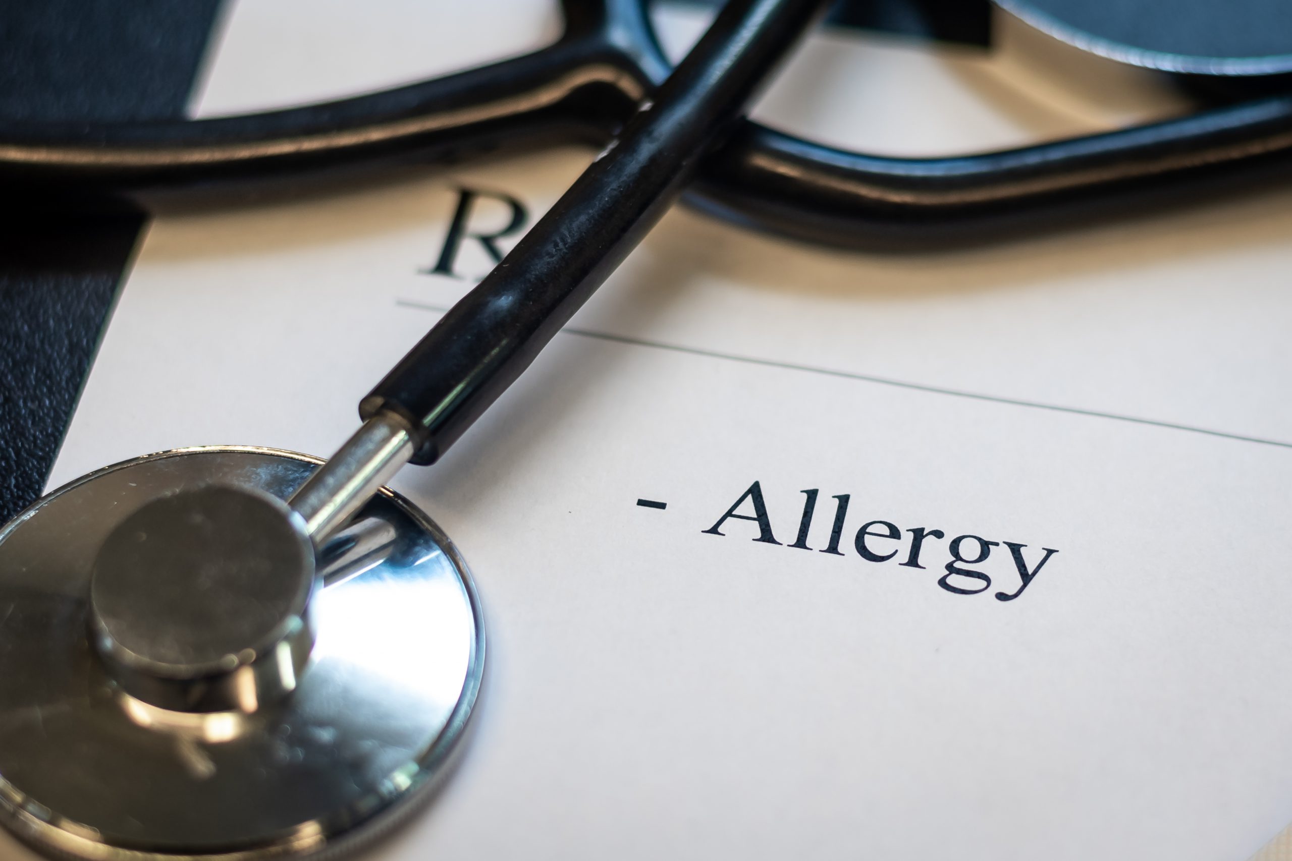 Allergy word written on a blank paper