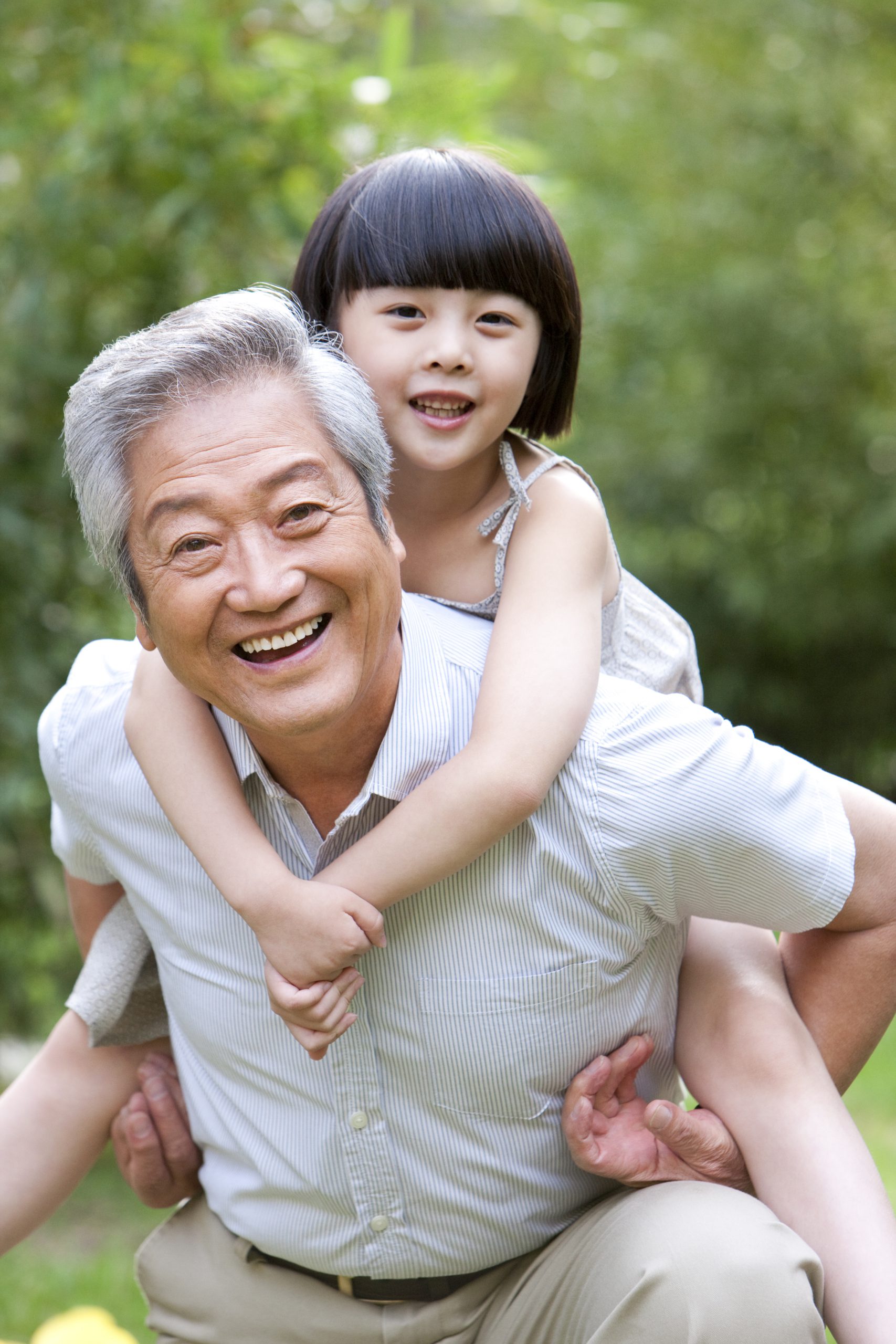 Grandpa and kid with bright smiles