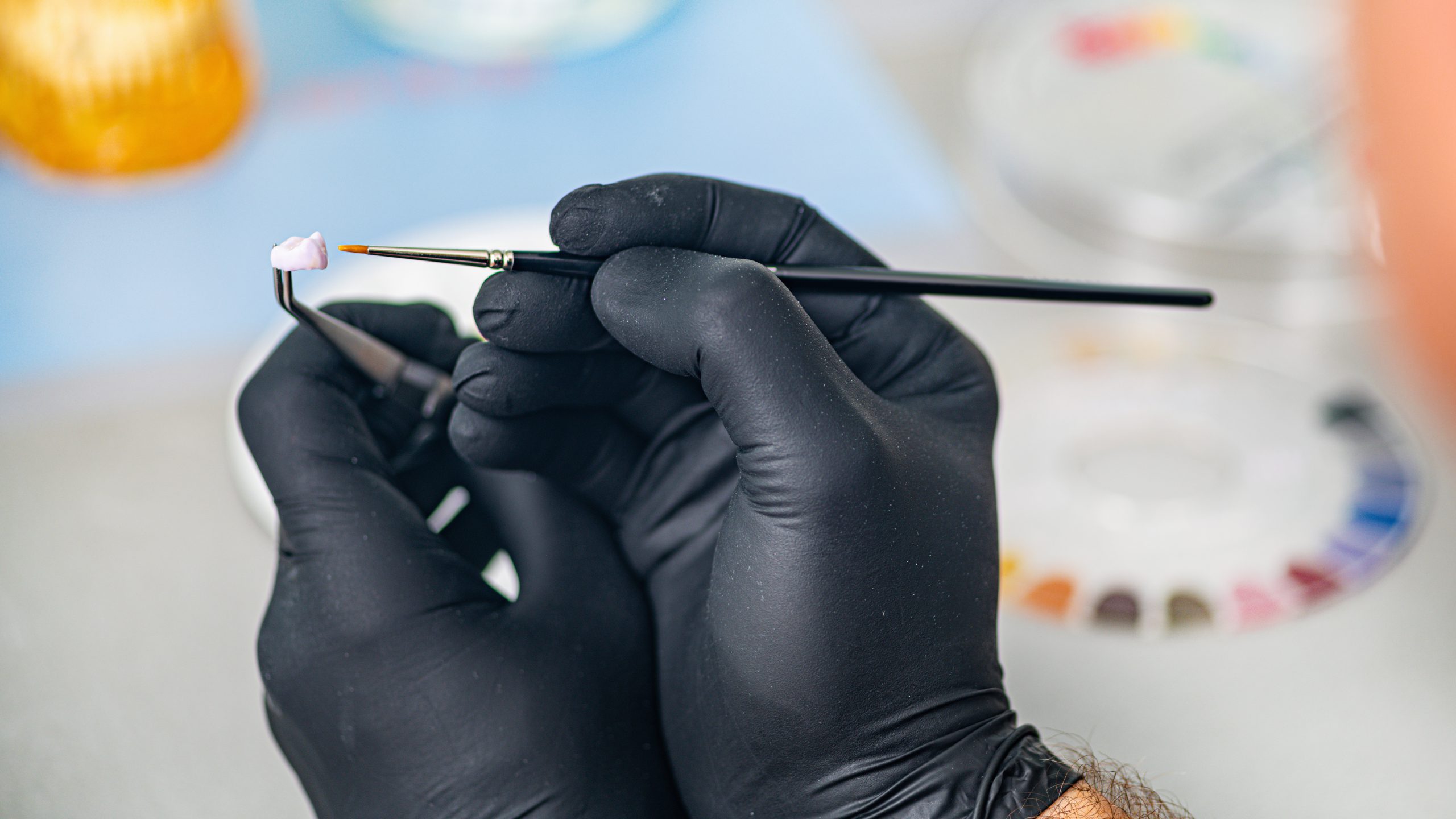 Dentist holding a set of crowns