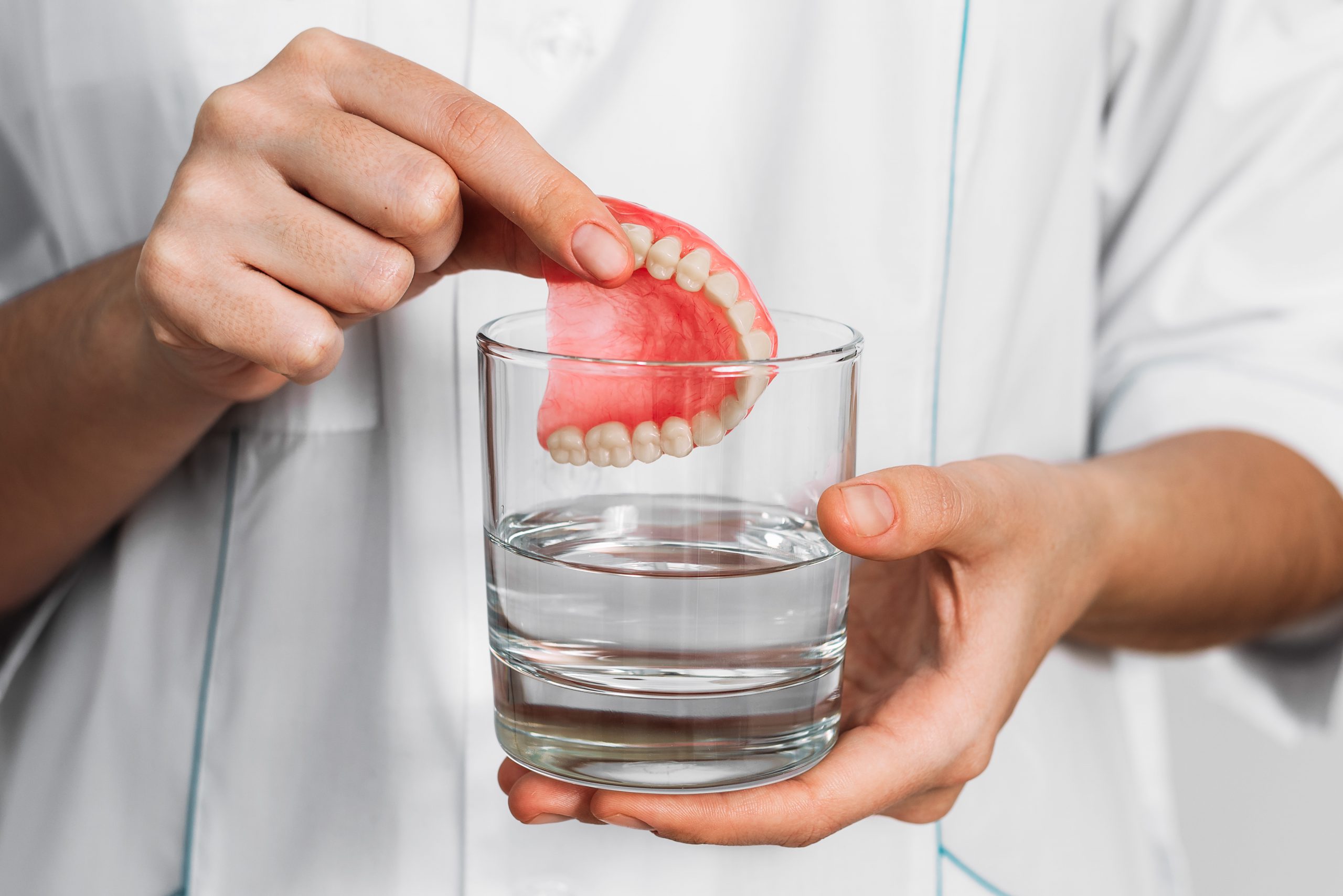 Dental prosthesis is cleaned with water