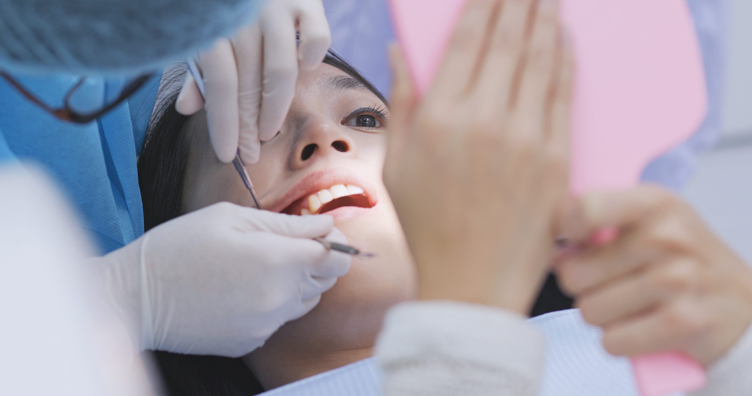 Dental patient checking out the ongoing dental operation