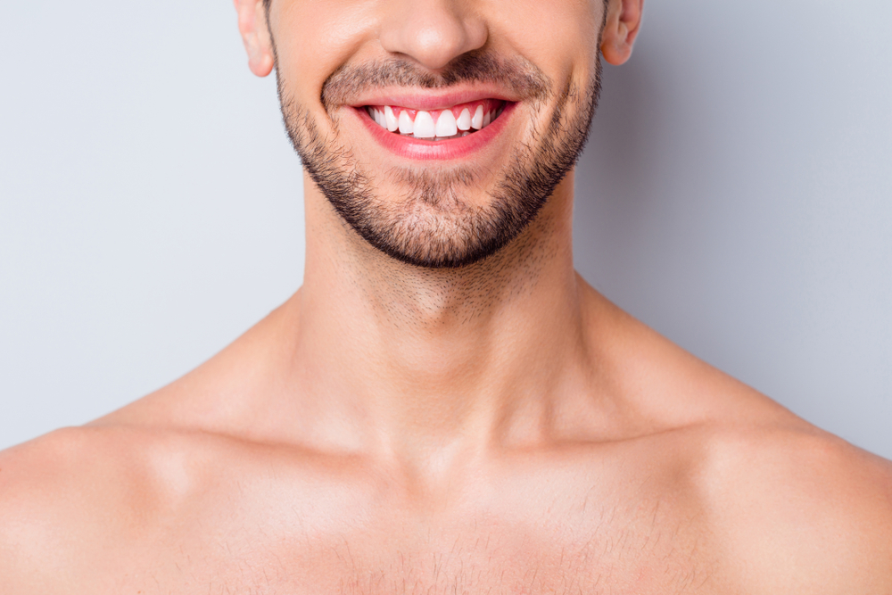 A person smiling confidently
