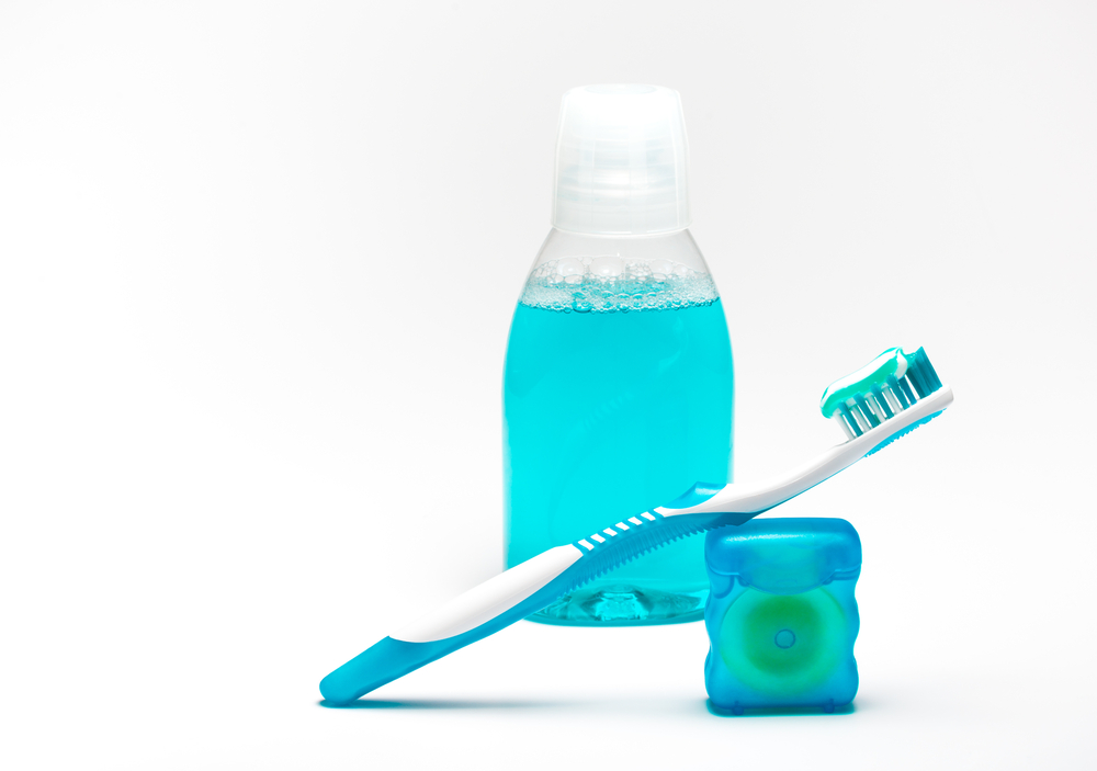  Toothbrush and dental floss representing oral hygiene