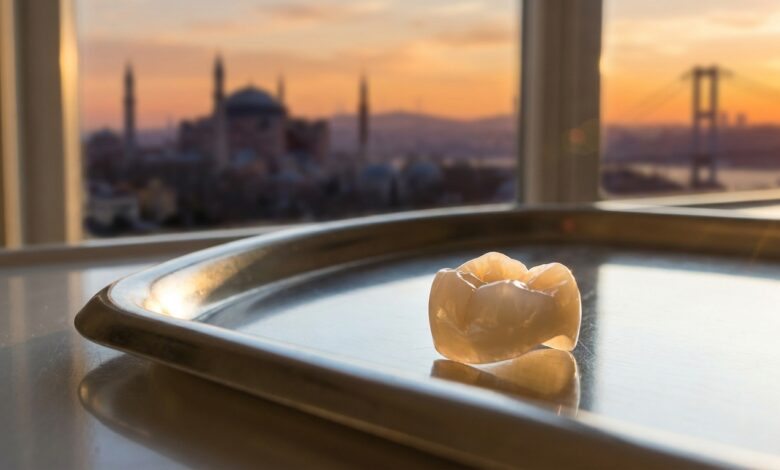 A photorealistic, ultra-detailed macro shot of a perfect E-Max dental crown resting on a sterile surface, with the beautiful, blurred skyline of Istanbul, Turkey visible in the background during a warm sunset.